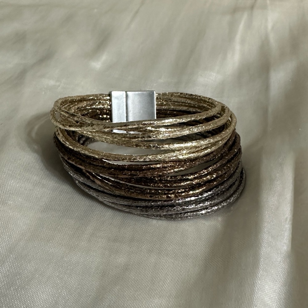 Elegant Gold and Silver Multi-Strand Bracelet